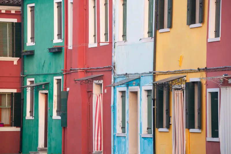 Traditional colorful houses lining the streets of Burano near Venice.