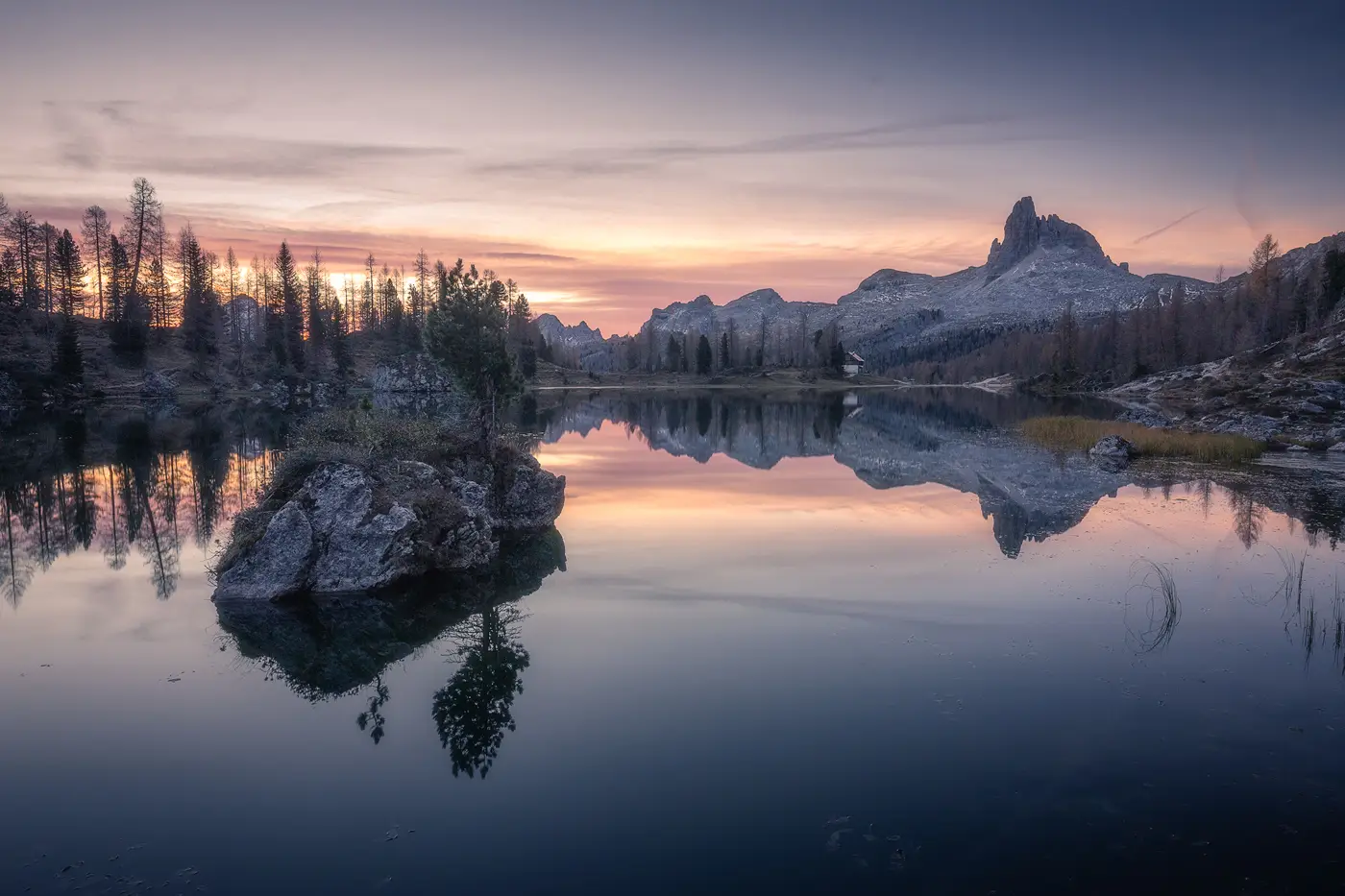 Lago Federa reflecting Croda da Lago at sunrise in the Dolomites near Cortina d'Ampezzo, Italy