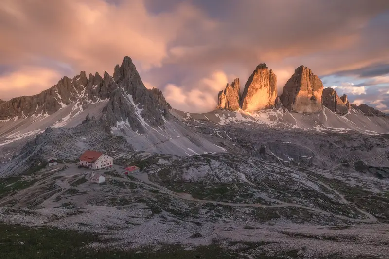 Tre Cime di Lavaredo and Rifugio Locatelli at sunset in the Dolomites