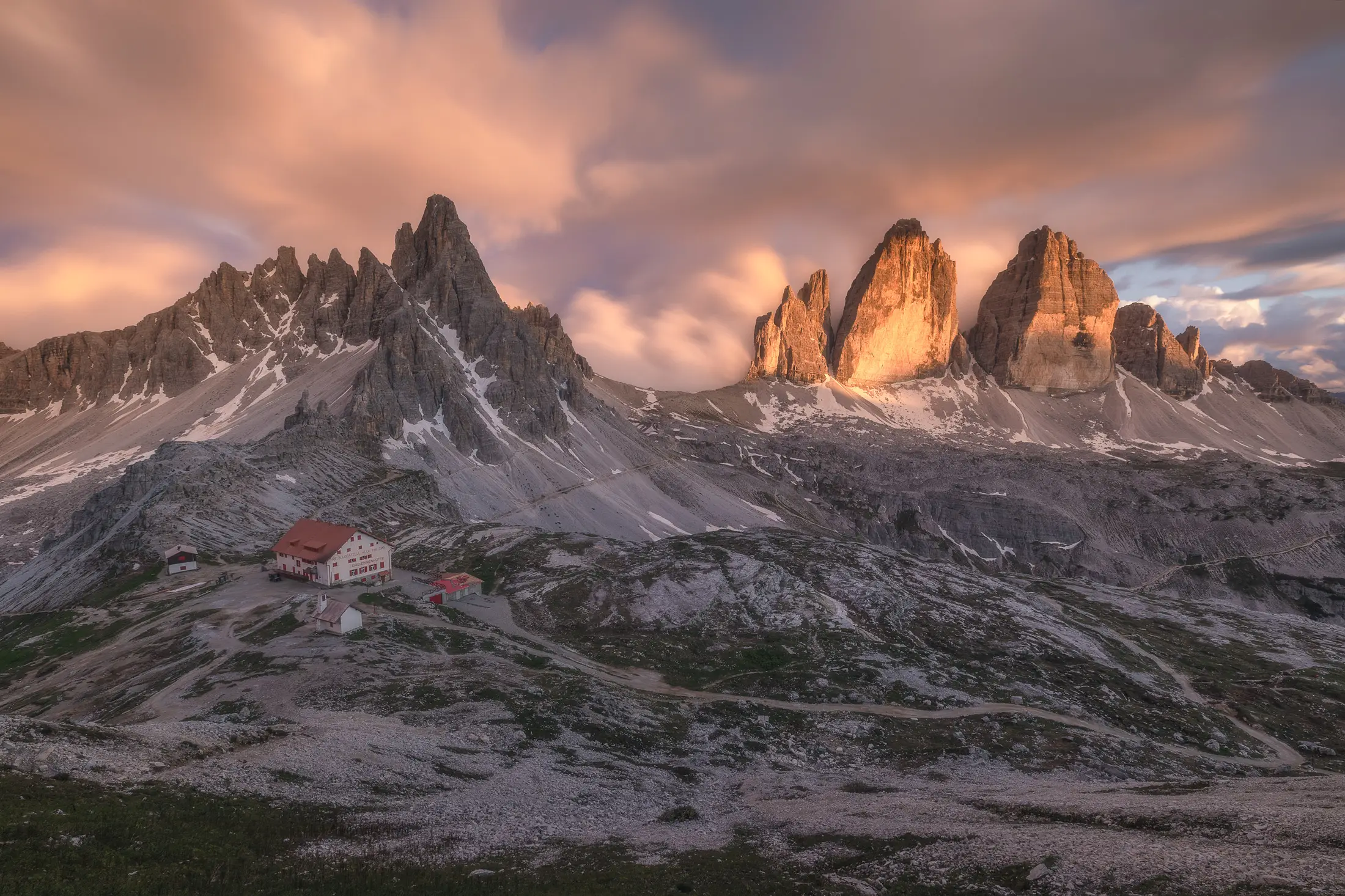 Tre Cime di Lavaredo and Rifugio Locatelli at sunset in the Dolomites